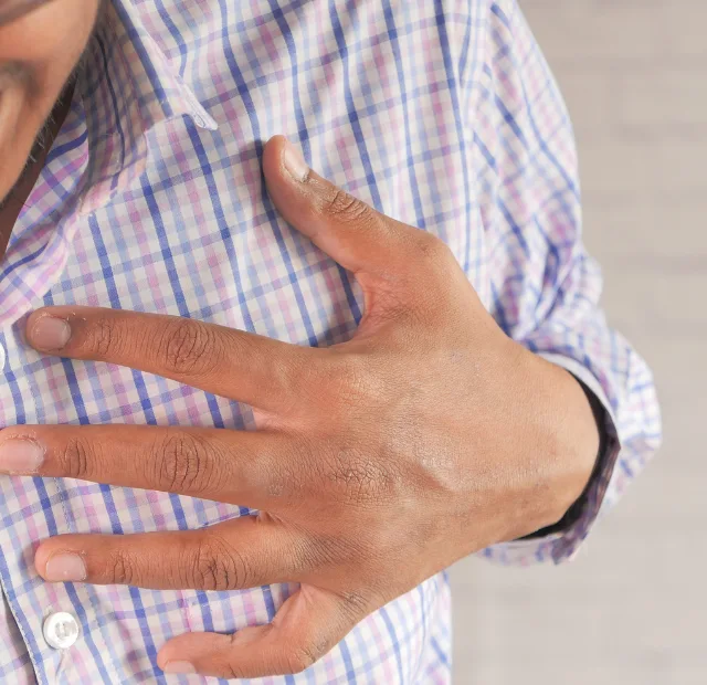 Doctor evaluating chest pain patient Pioneer Medical Frisco TX